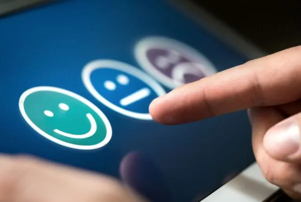 customer satisfaction faces with finger pointed to select one