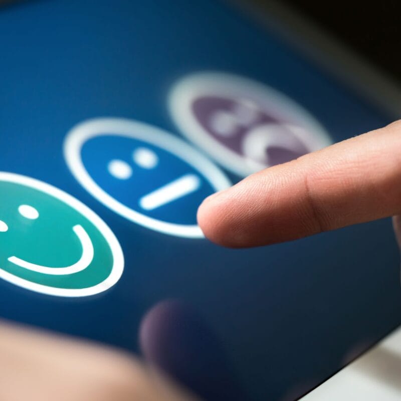 customer satisfaction faces with finger pointed to select one